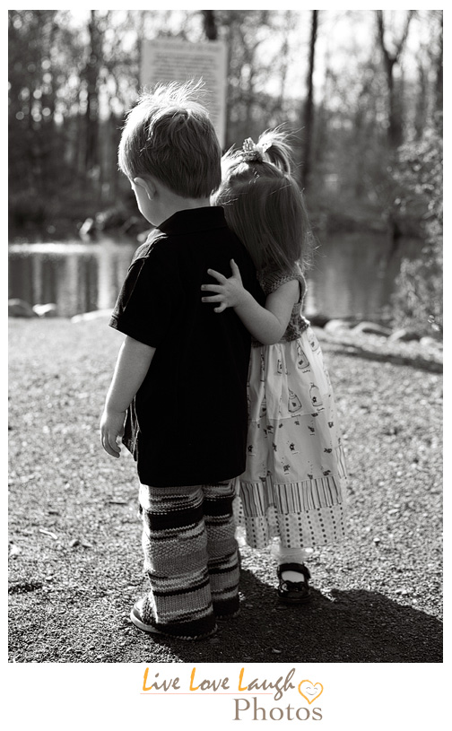 Twin toddlers hugging at a photo session in Ridgewood