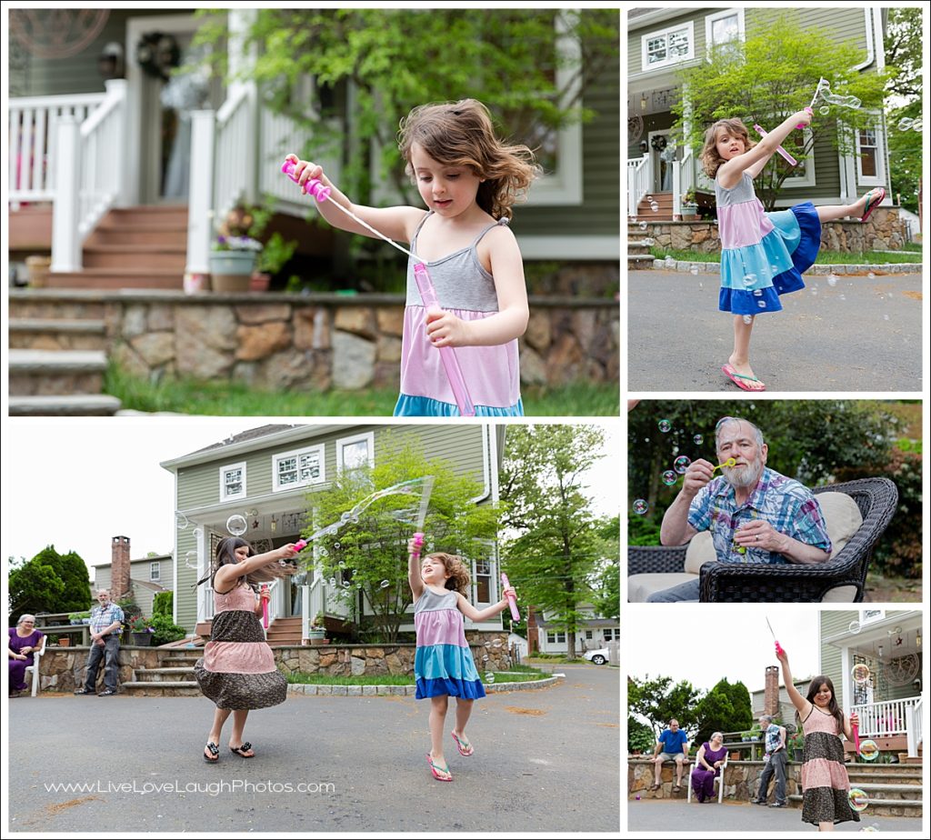 GIrls blowing bubbles at a family photo session in their Midland Park Home